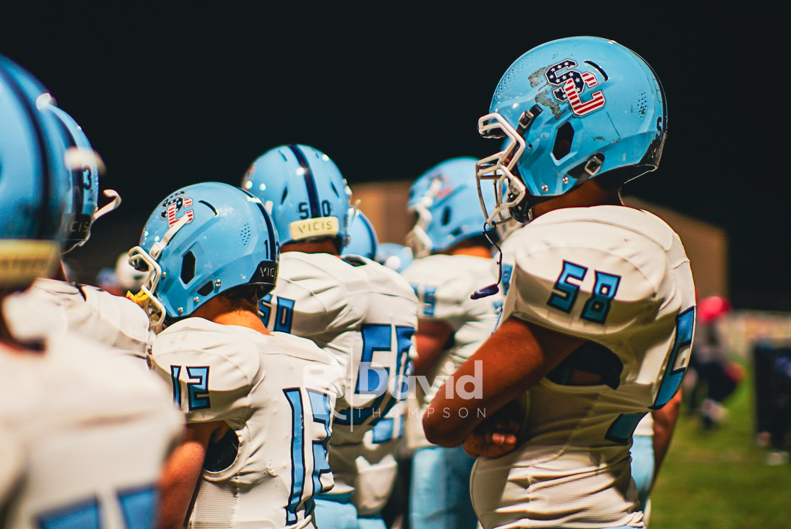 a picture of football team standing around